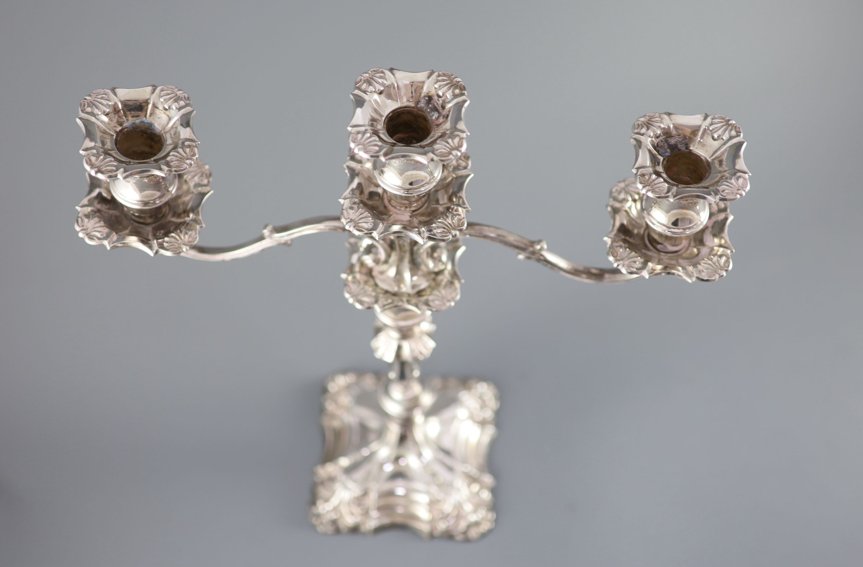 A modern pair of silver two branch, three light candelabra by Roberts & Belk